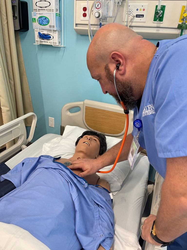 Darren Benari practices his nursing skills.