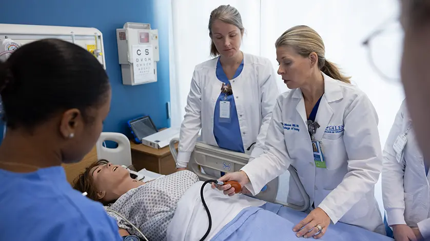 Galen nursing instructors and students gathered around a 