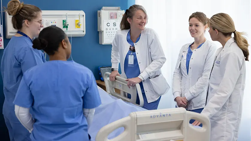 Galen nursing instructors and students gathered around a 